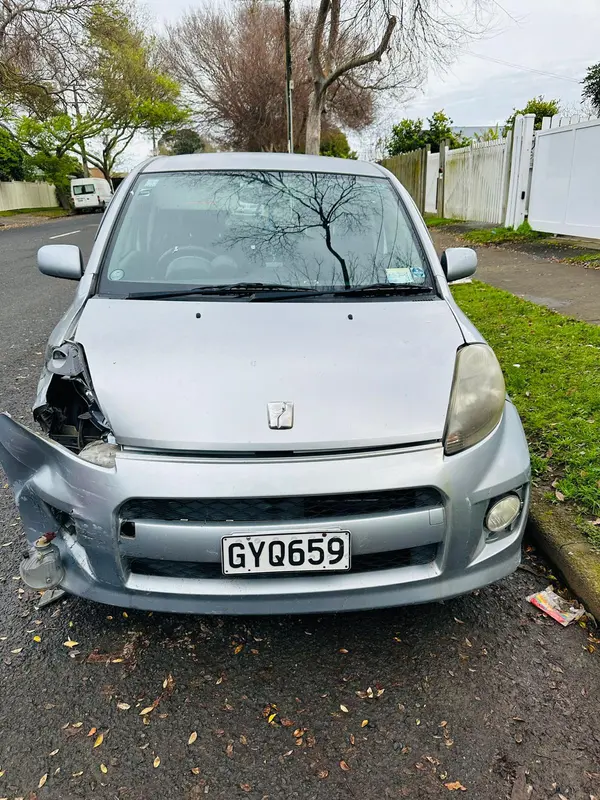 Honda hatchback with damaged front corner